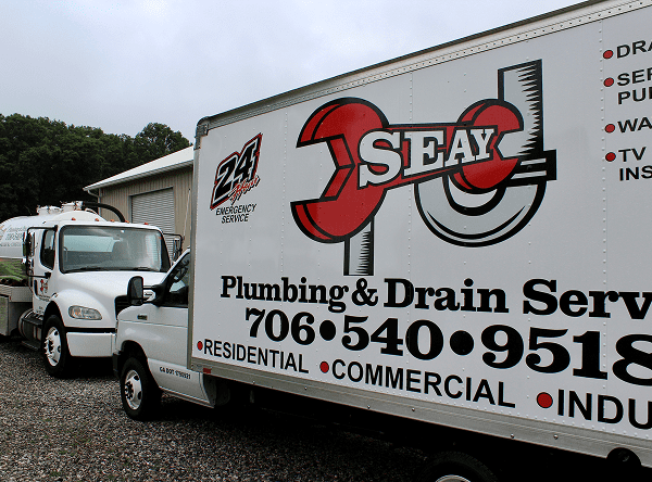 Seay Plumbing & Drain Service truck and contact information on side of vehicle